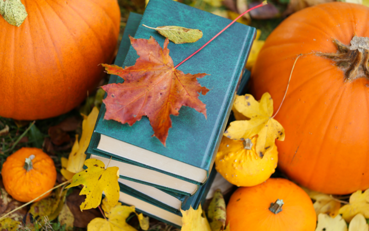 books with pumpkins and leaves